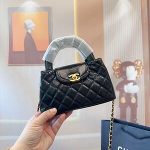 Chanel Black Quilted Mini Bag with Gold Accent